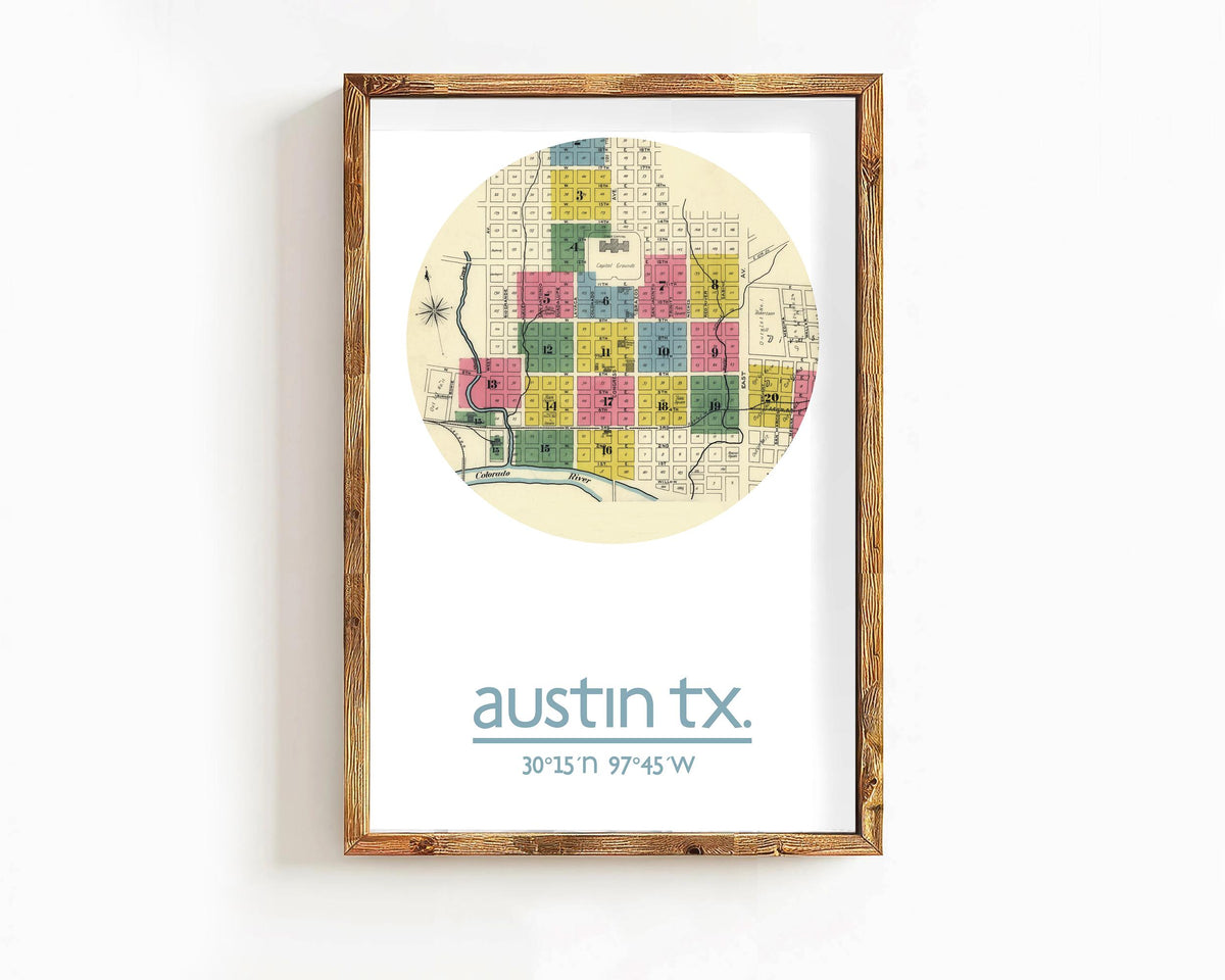 The image is a framed print of a map of Austin, Texas, with a wooden frame.