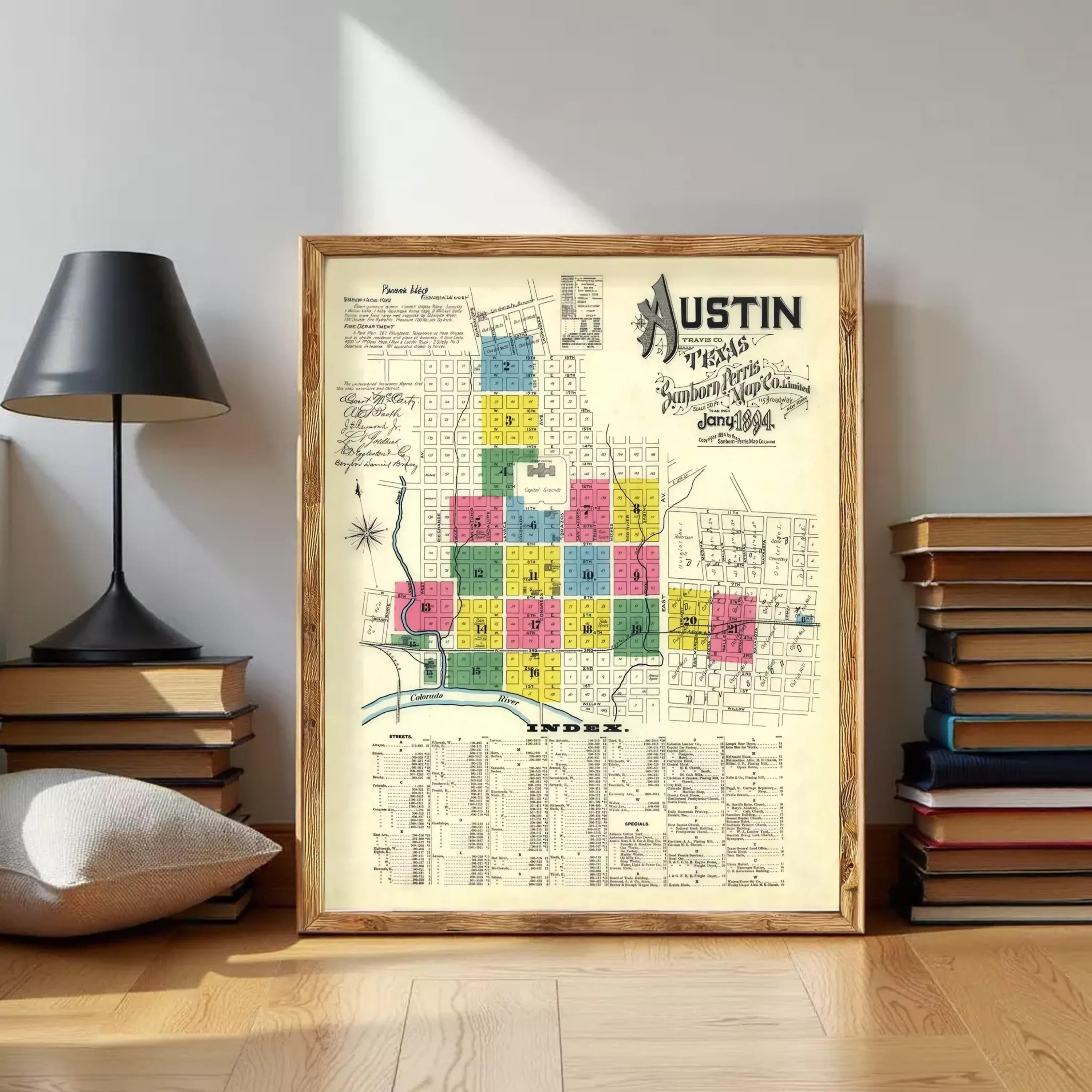 The image is a framed vintage map of Austin, Texas, showing the city's layout and various landmarks.