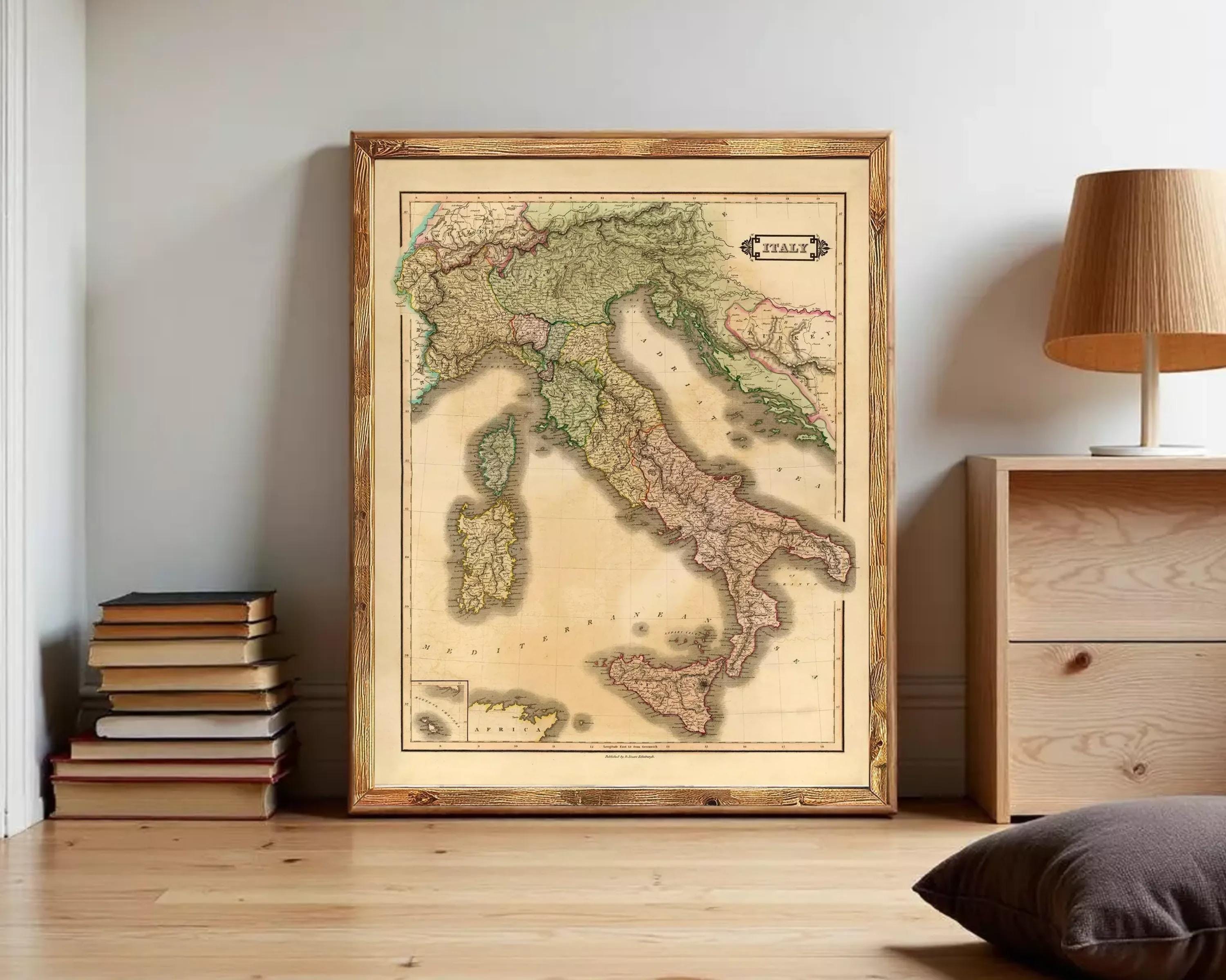 The image is a framed vintage map of Italy, depicting the country's geographical layout and surrounding areas.