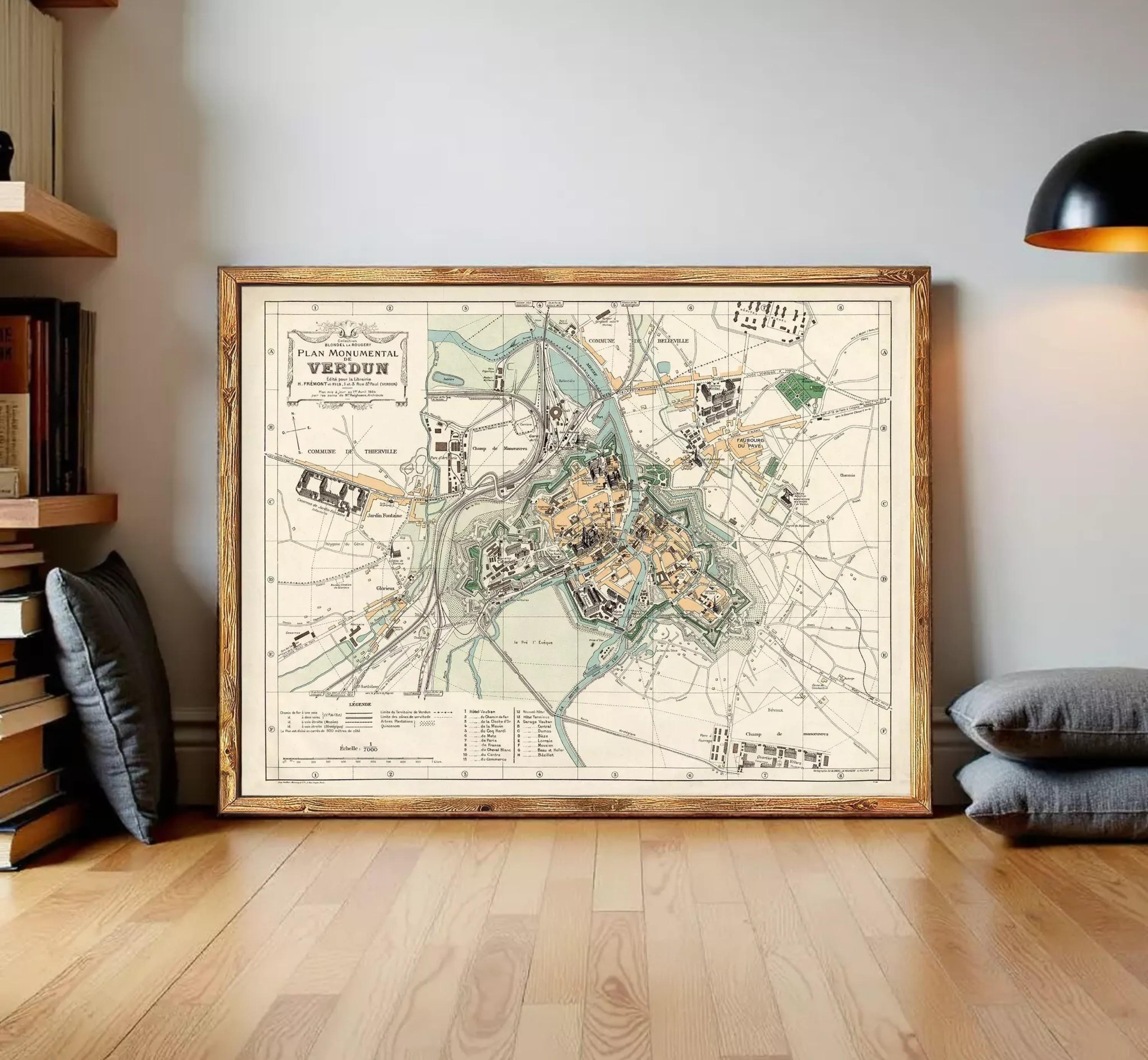 The image is a framed vintage map of a city, depicting various landmarks and streets.