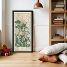 a framed map of a region, with a wooden bookshelf and a child's toy car in the foreground.