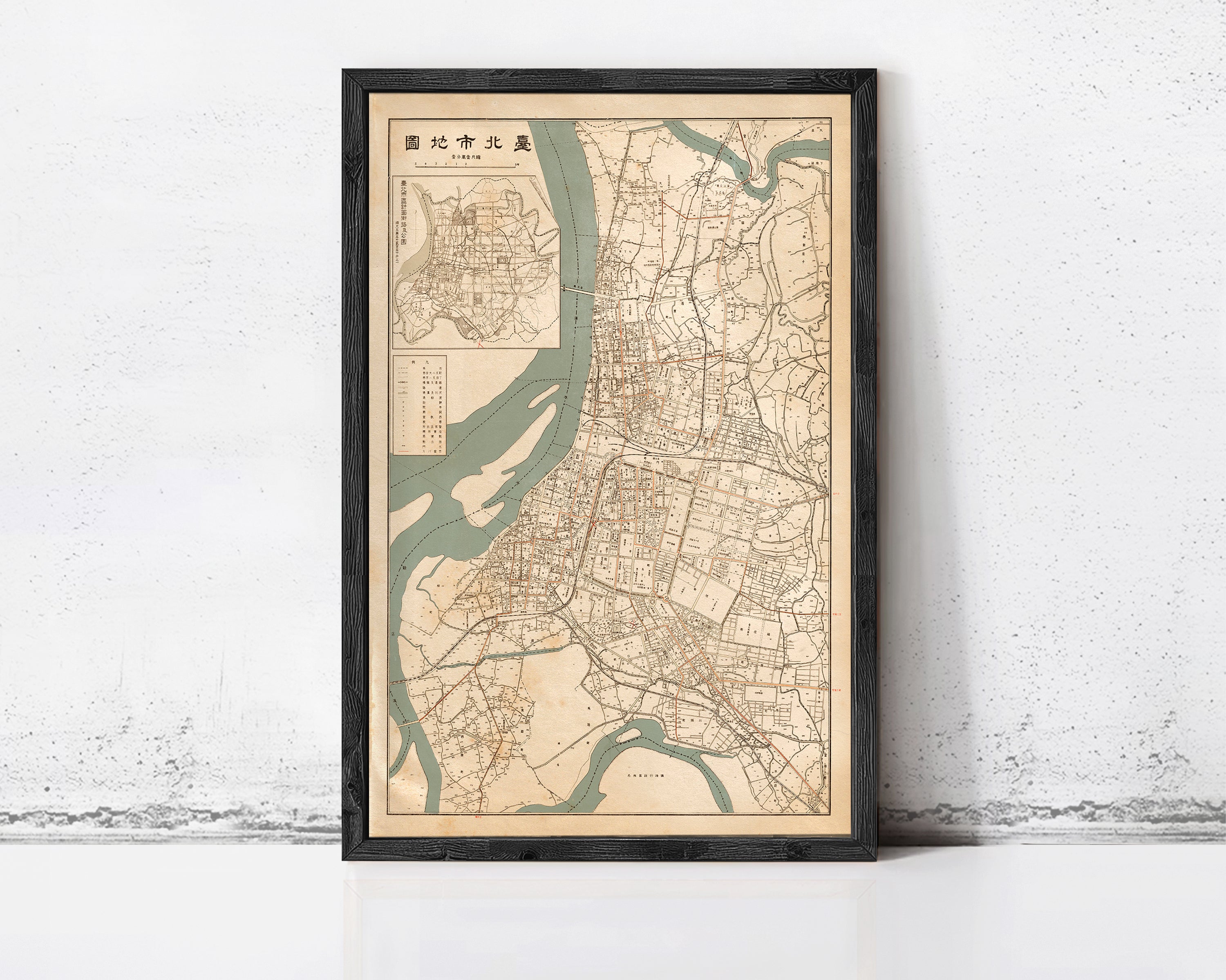 The image is a framed map of a city, likely from the 19th century, with a detailed layout of streets, rivers, and other geographic features.