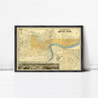 The image is a framed vintage map of London, England, with a black border and yellow and blue color scheme.