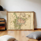 The image is a framed historical map of a city, likely Paris, with detailed geographical information and labels.
