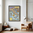 The image is a framed illustration of a map of Italy, depicting various landmarks and geographical features.