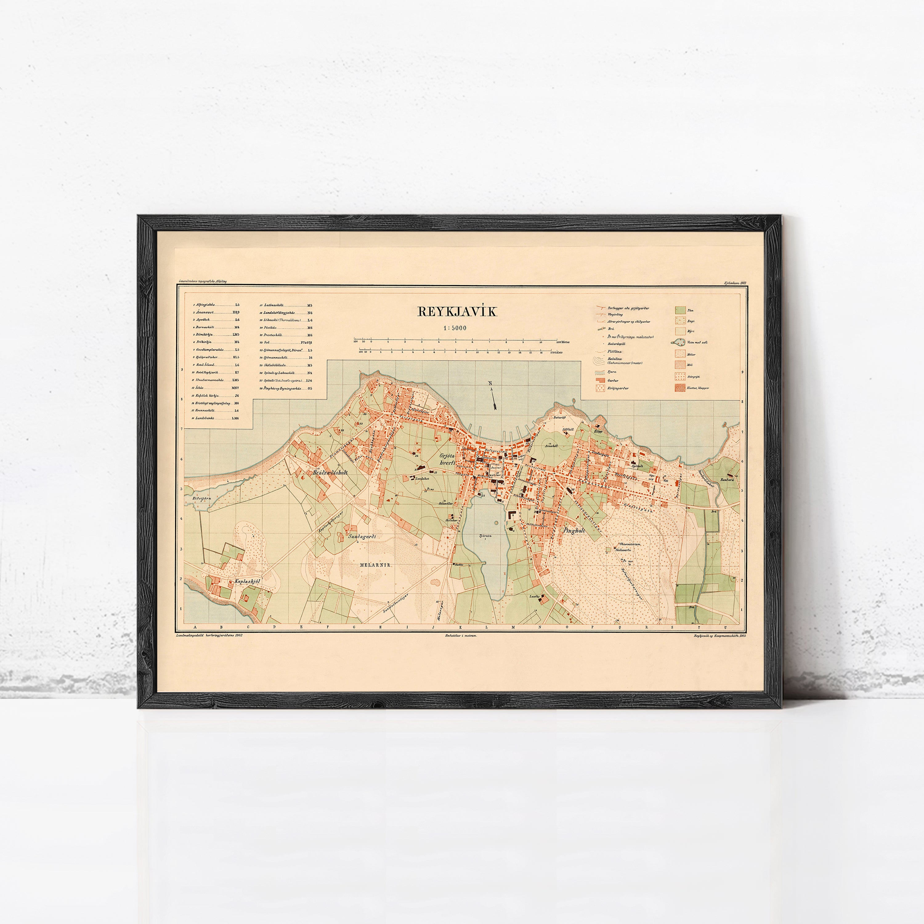 The image is a framed map of Reykjavik, Iceland, showing the city's layout and surrounding areas.