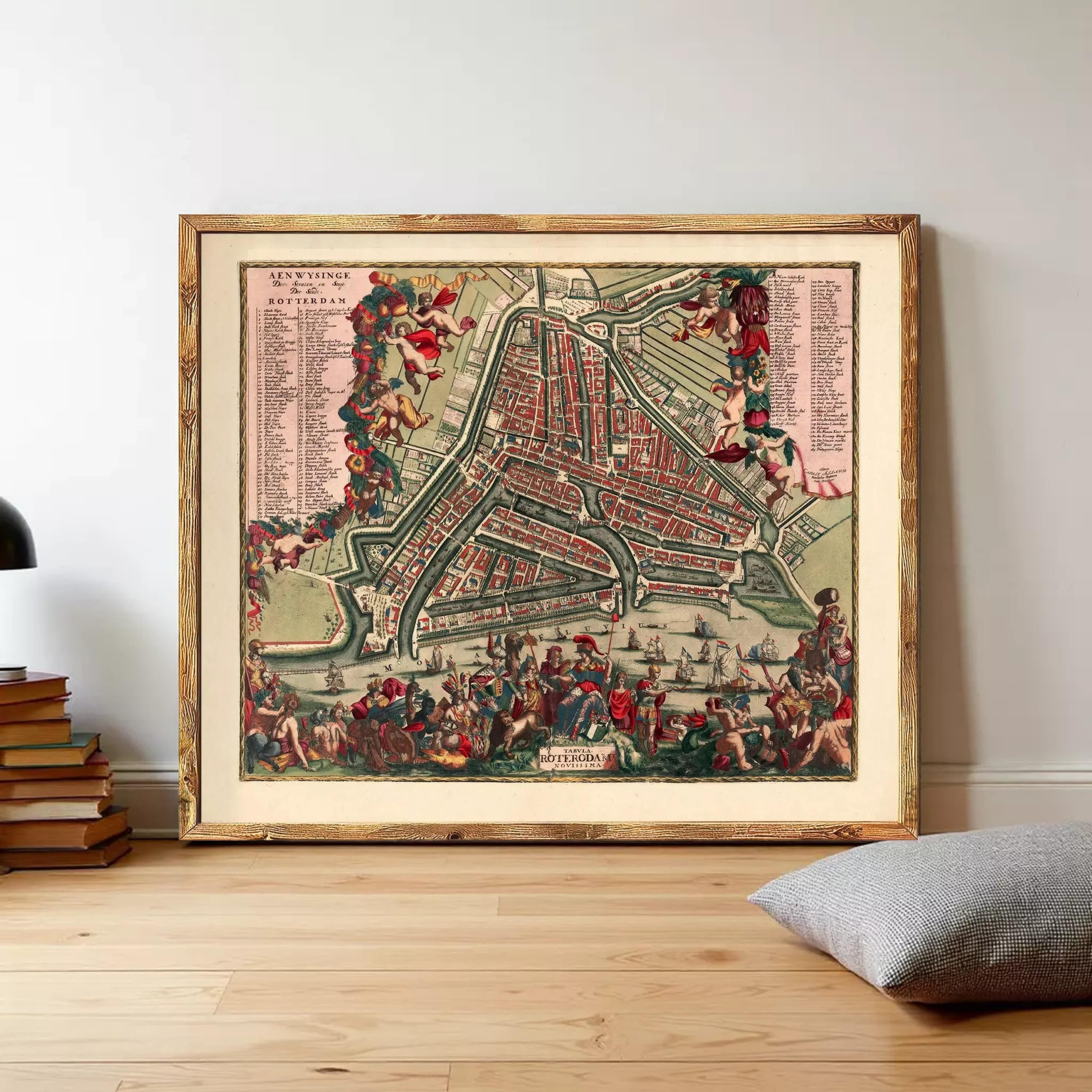 The image is a framed vintage map of Amsterdam, Netherlands, depicting a detailed and colorful cityscape with various landmarks and streets.