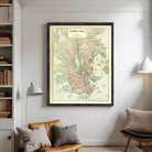 The image is a framed map of Melbourne, Australia, showing the city's streets, landmarks, and surrounding areas.