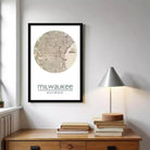 A framed map of Milwaukee, Wisconsin, with the city's name and location printed on it.