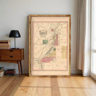 a large framed map of a city or region, with various labels and markings indicating different locations or areas.
