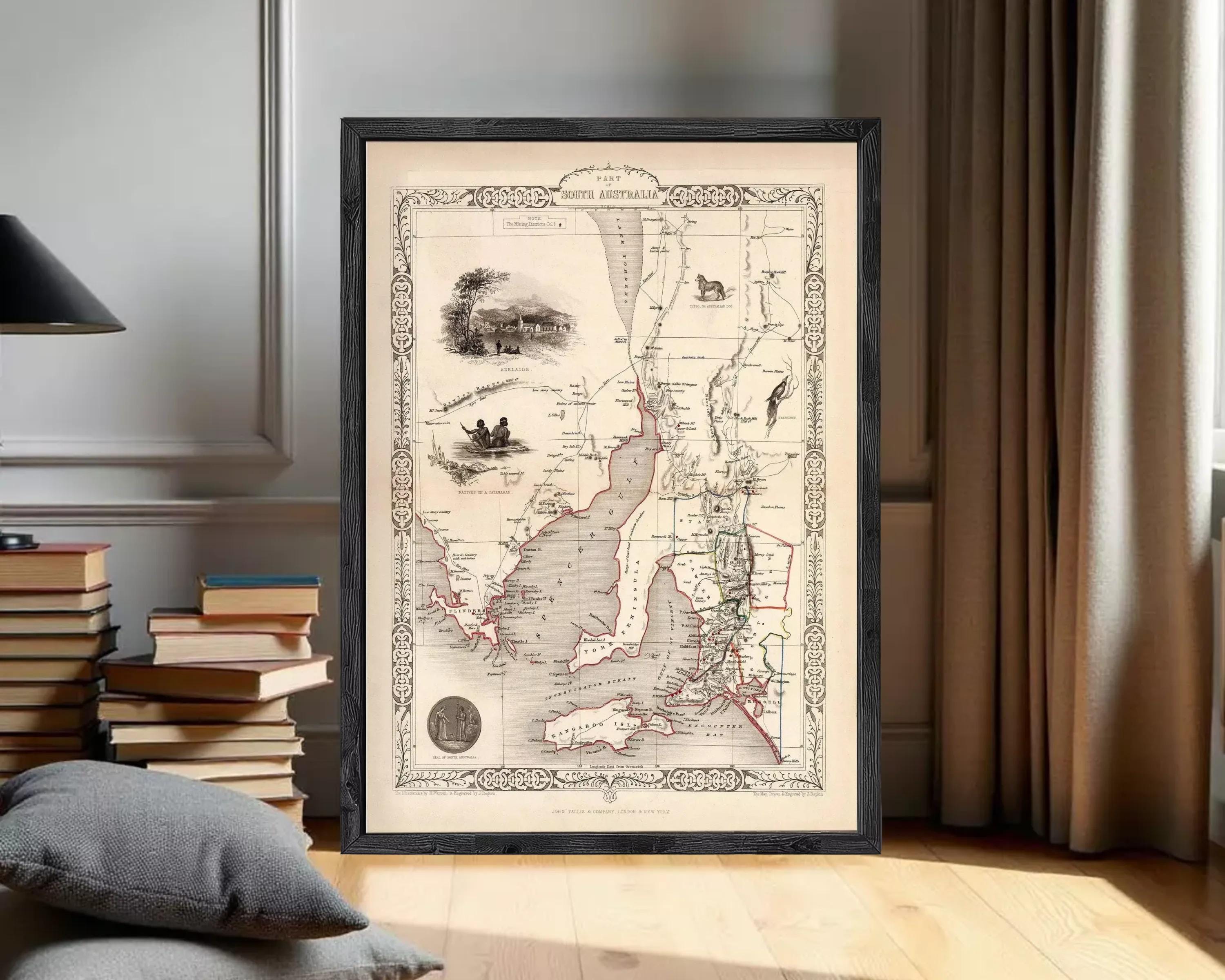 The image is a framed vintage map of the South Australia region, featuring detailed illustrations and geographical information.