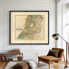 The image is a framed map of the Netherlands, depicting the country's geographical layout and boundaries.