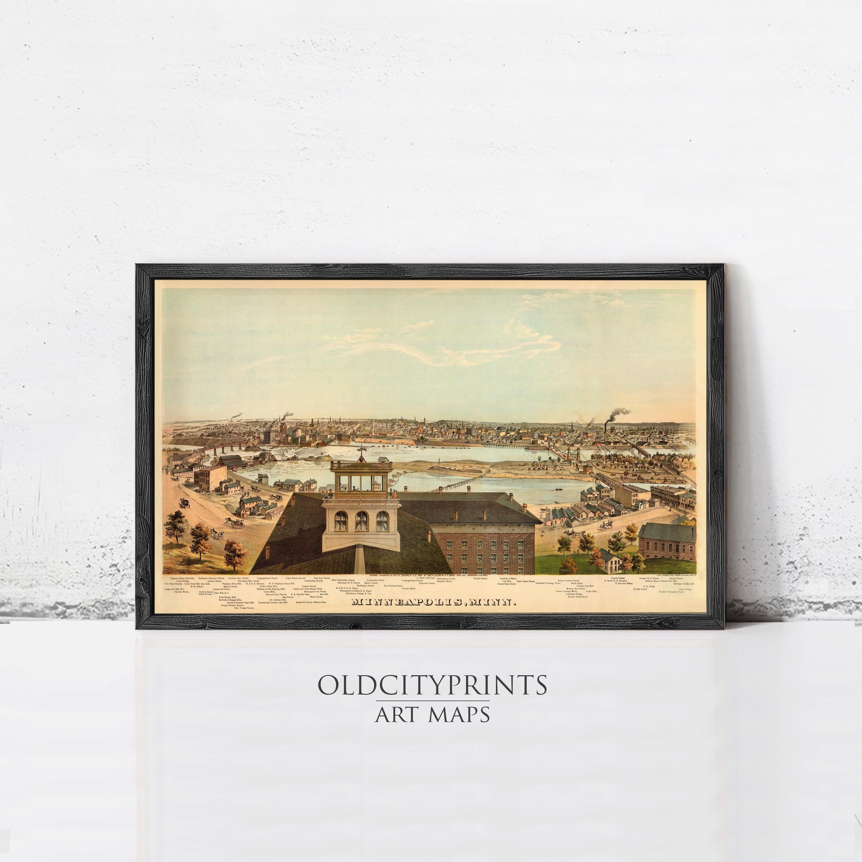 The image is a framed art print depicting a cityscape with buildings, a river, and a bridge.