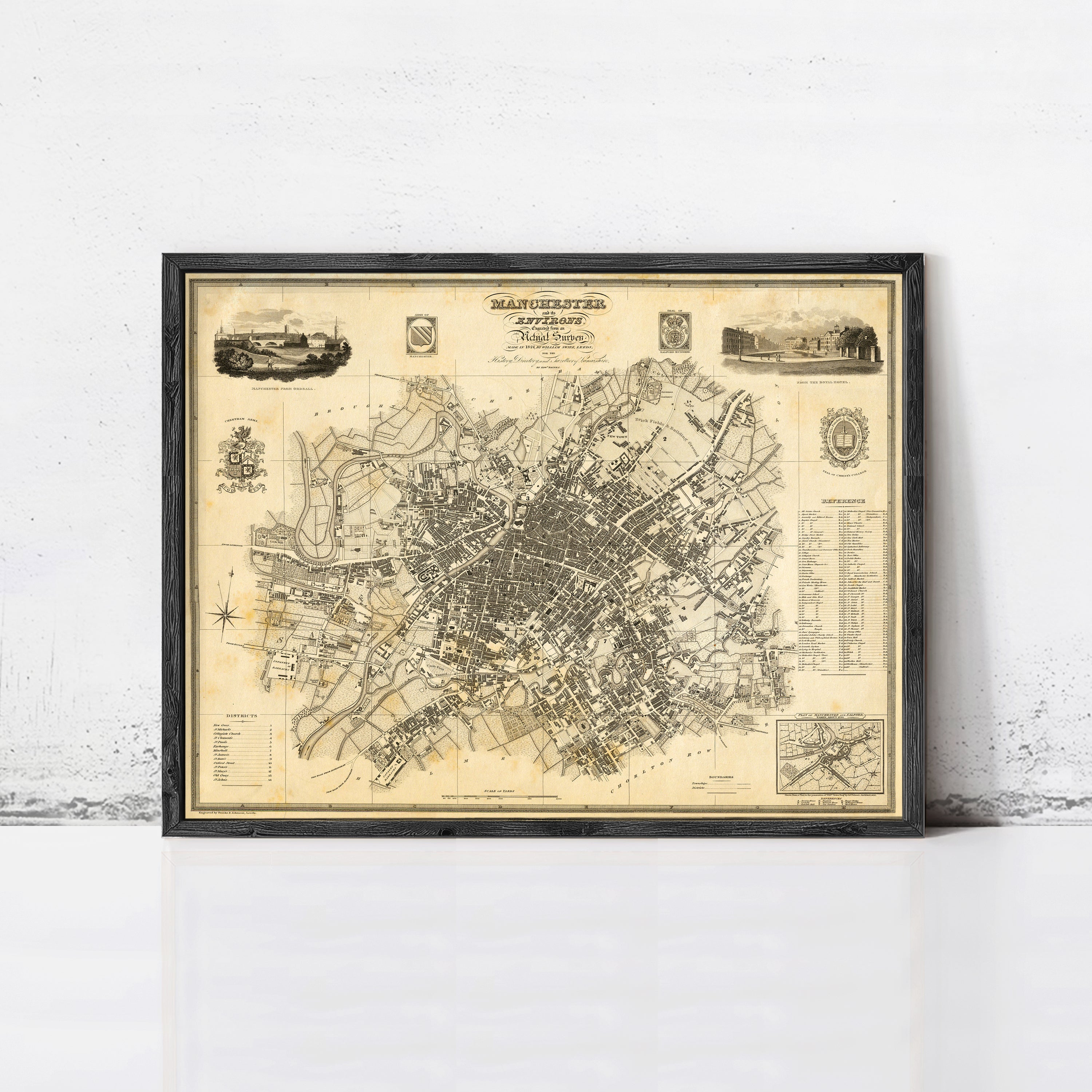 The image is a framed historical map of Manchester, England, dating back to 1829.