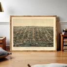 The image is a framed print depicting a bird's eye view of a city, likely Alexandria, Virginia.