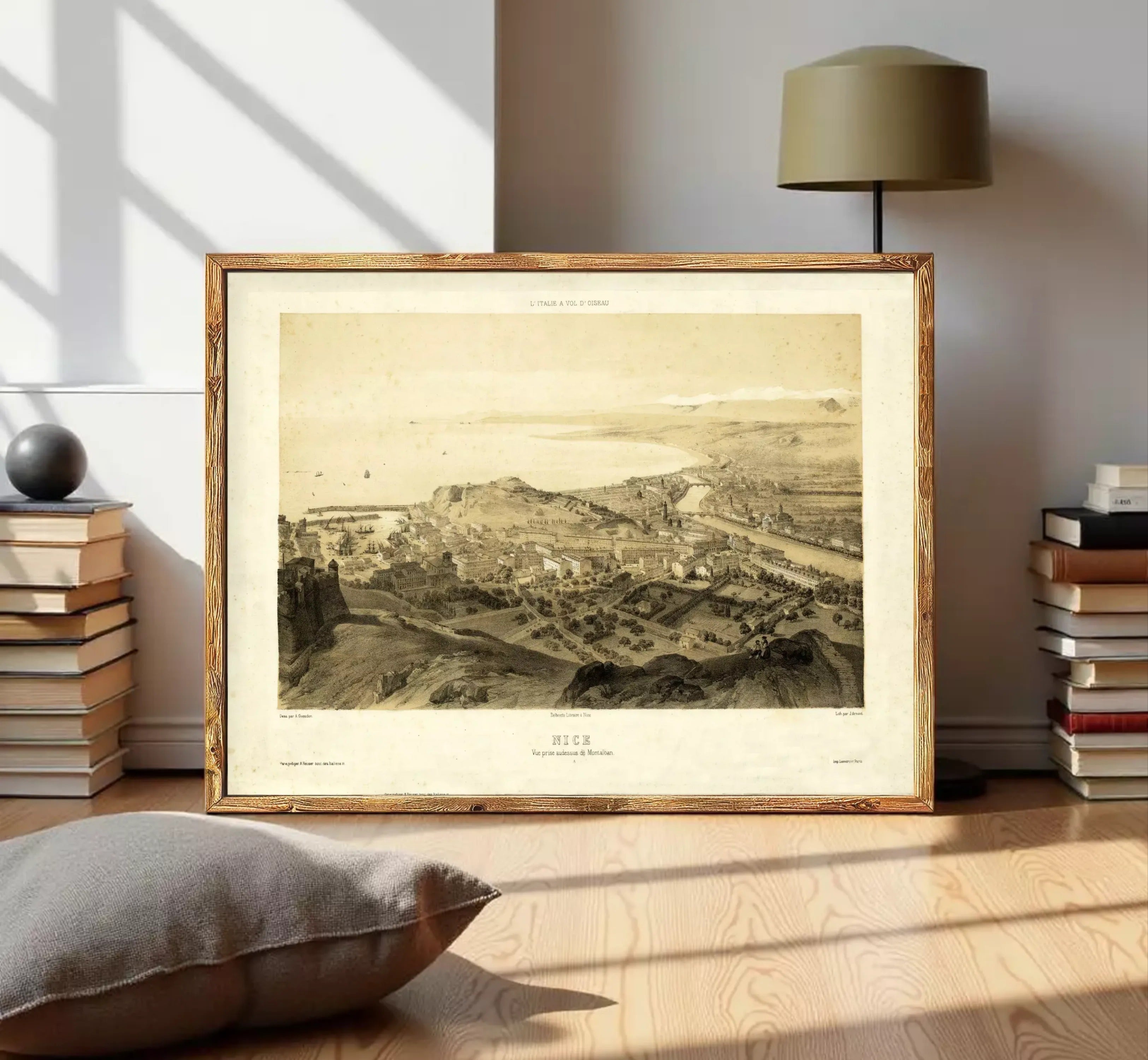The image is a framed print depicting a cityscape, likely from the 19th century, with a detailed and intricate view of the city's layout and architecture.