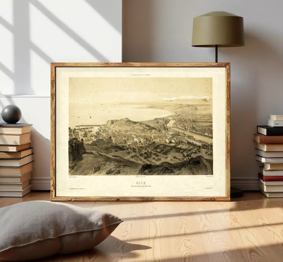 The image is a framed print depicting a cityscape, likely from the 19th century, with a detailed and intricate view of the city's layout and architecture.