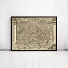 The image is a large, detailed map of a city or region, displayed in a frame on a white wall.