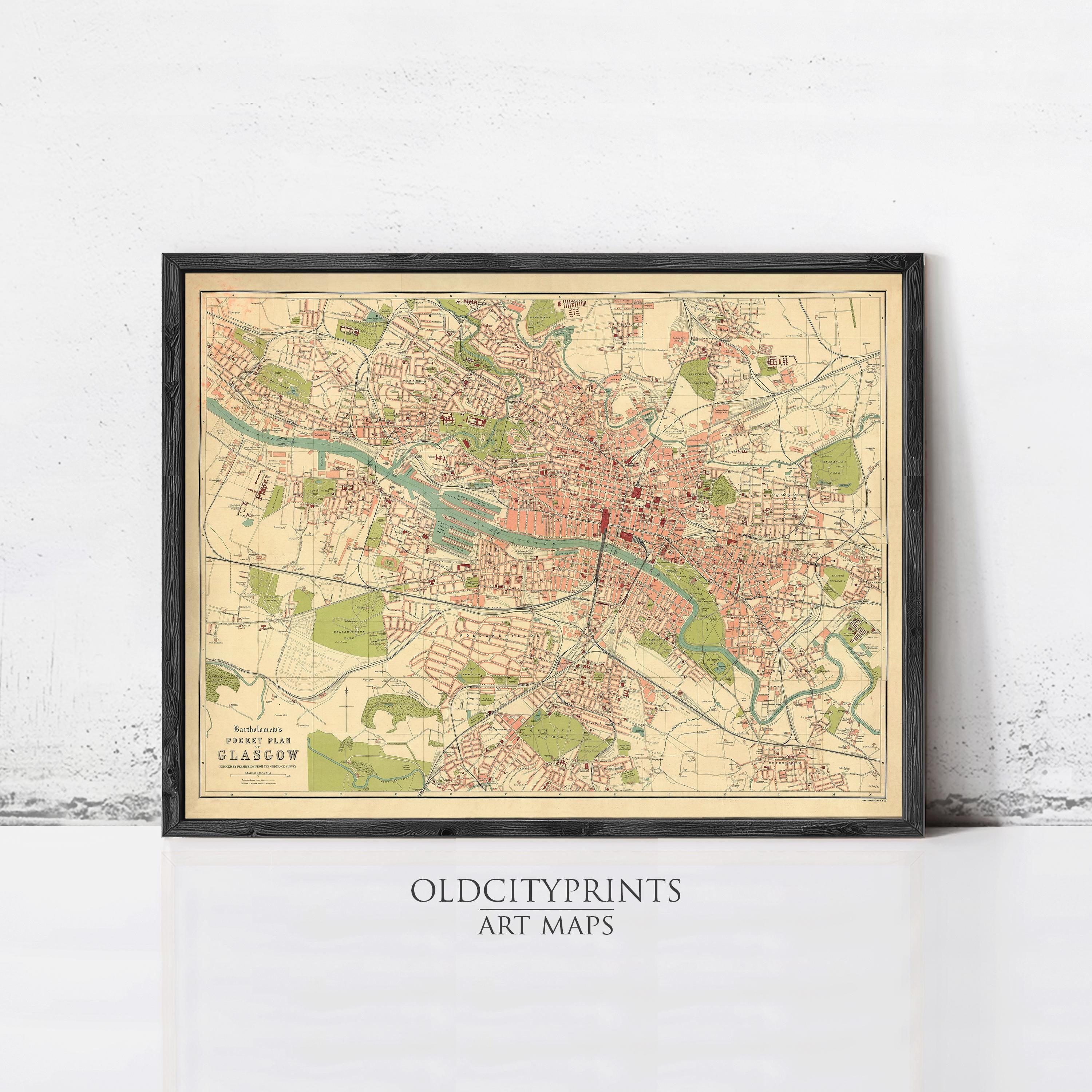 The image is a framed vintage map of a city, likely London, with various streets, landmarks, and parks depicted.