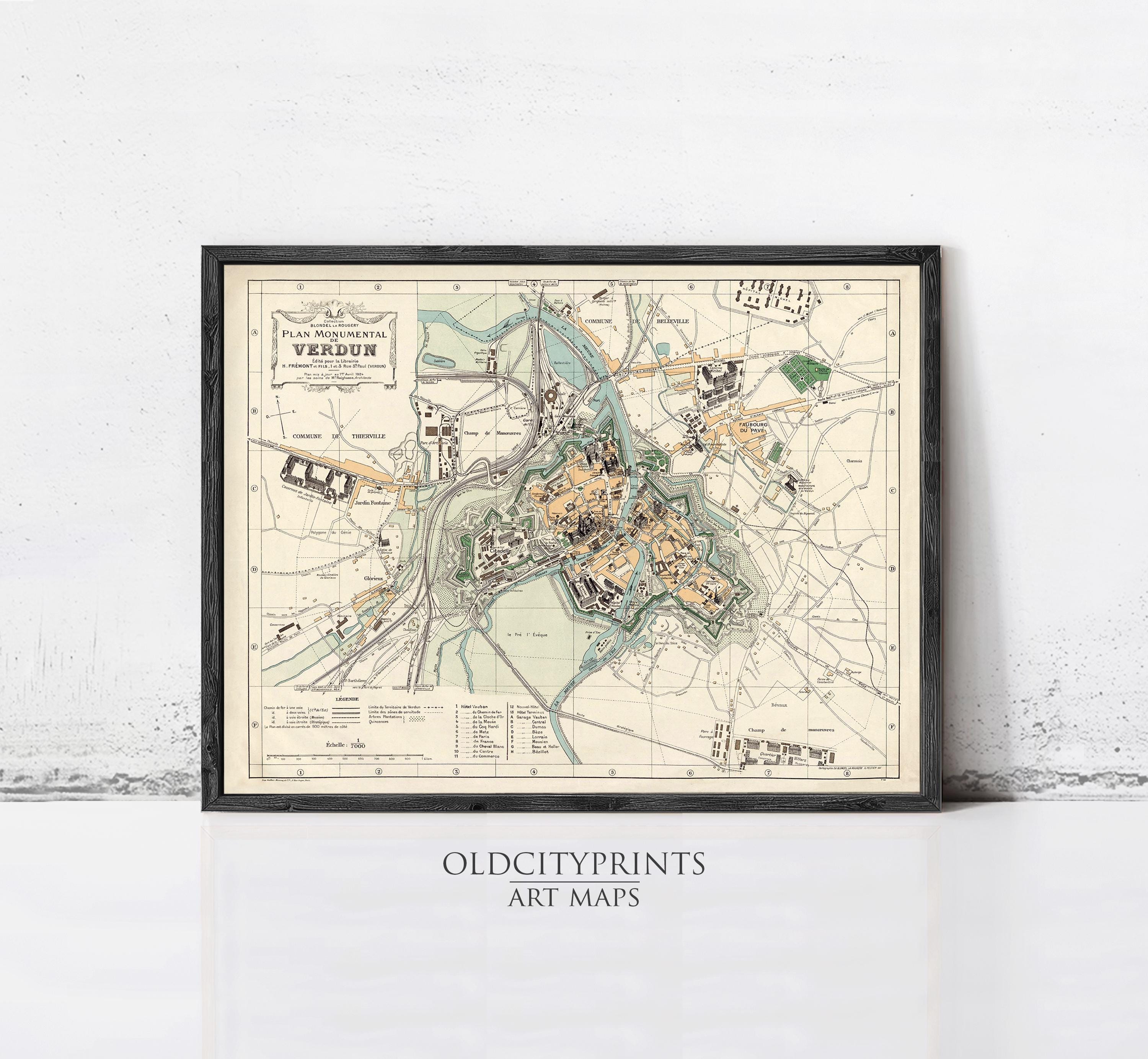 The image is a framed vintage map of a city, likely from the past, with various landmarks and streets depicted.