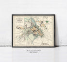 The image is a framed vintage map of a city, likely from the past, with various landmarks and streets depicted.