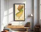 The image is a framed geological map of New Jersey, depicting the state's geographical features and boundaries.