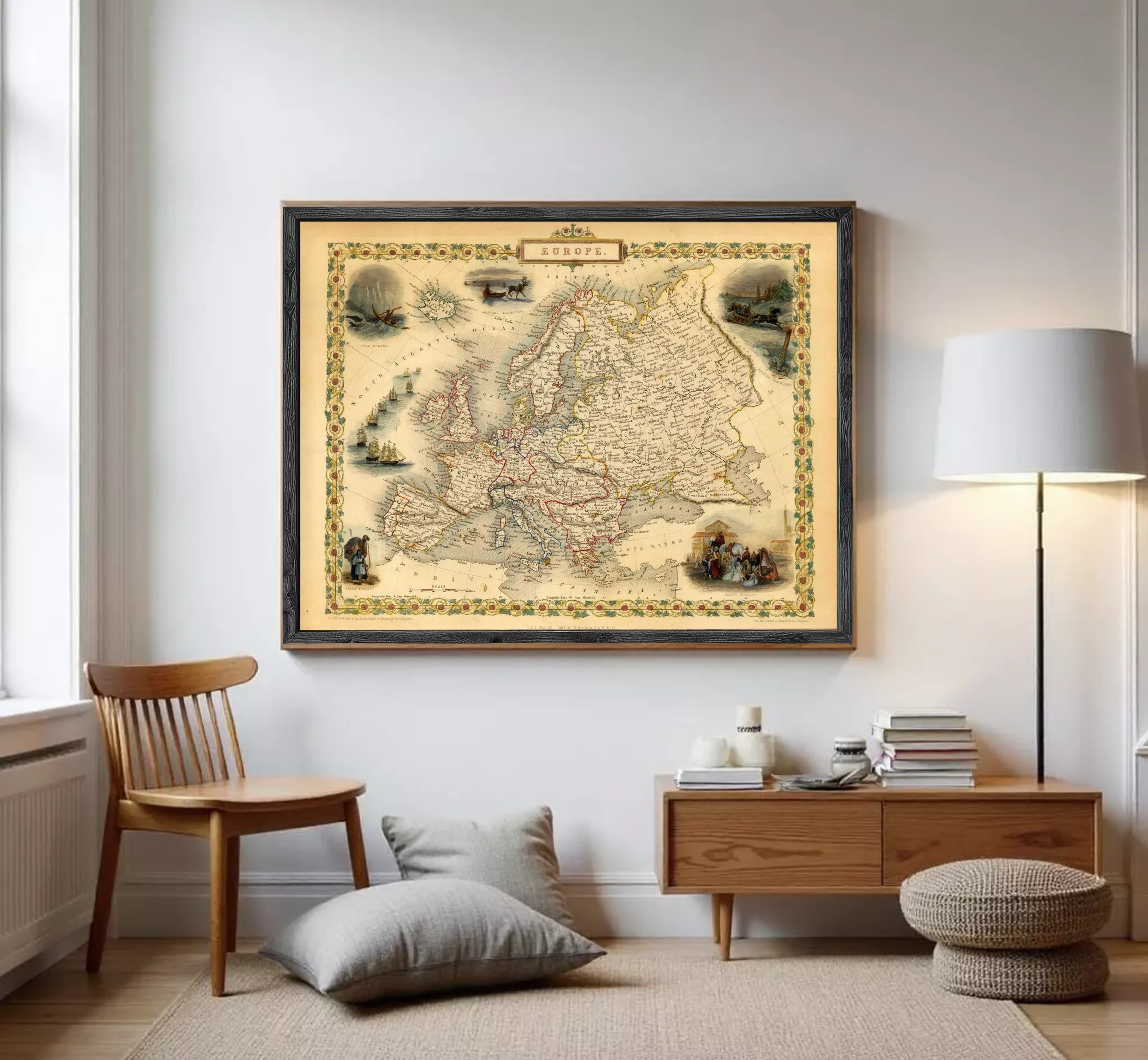 The image is a framed vintage map of Europe, featuring various illustrations and labels.