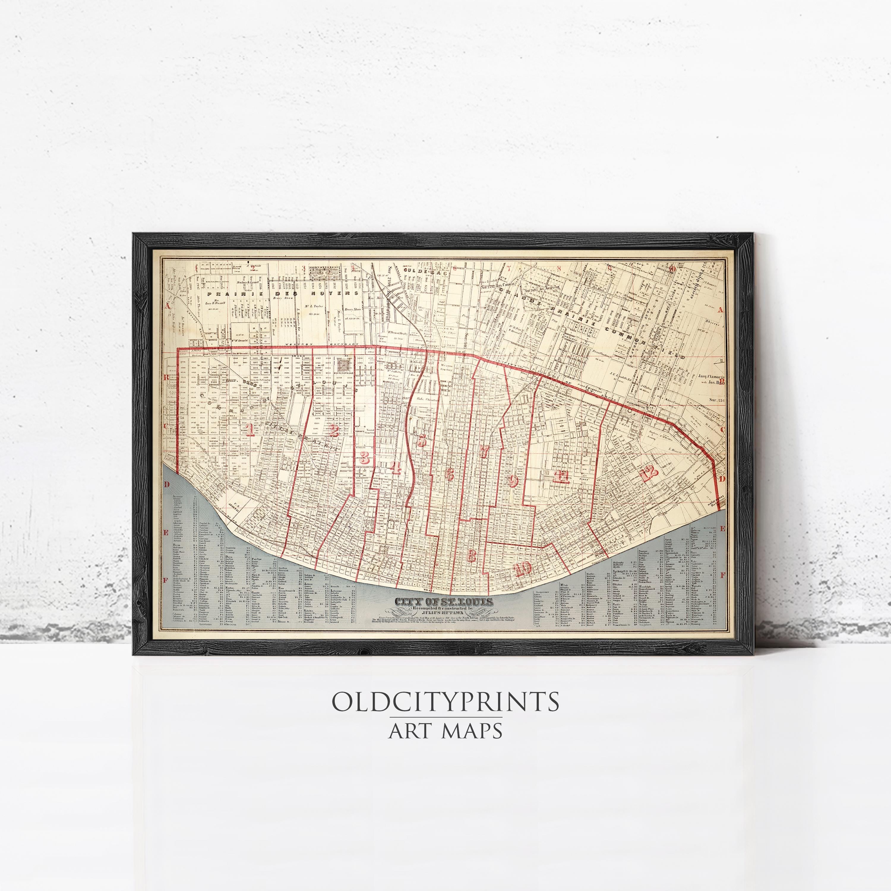 The image is a framed vintage map of a city, likely New Orleans, with a black border and red lines indicating streets and neighborhoods.