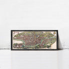 The image is a framed map of a city, likely Rome, with a detailed and colorful depiction of the urban layout and surrounding areas.