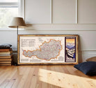 The image is a framed map of Austria, with a mountain landscape visible in the corner.