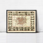 The image is a framed vintage map of Manchester, London, England, depicting various buildings and landmarks within the city.