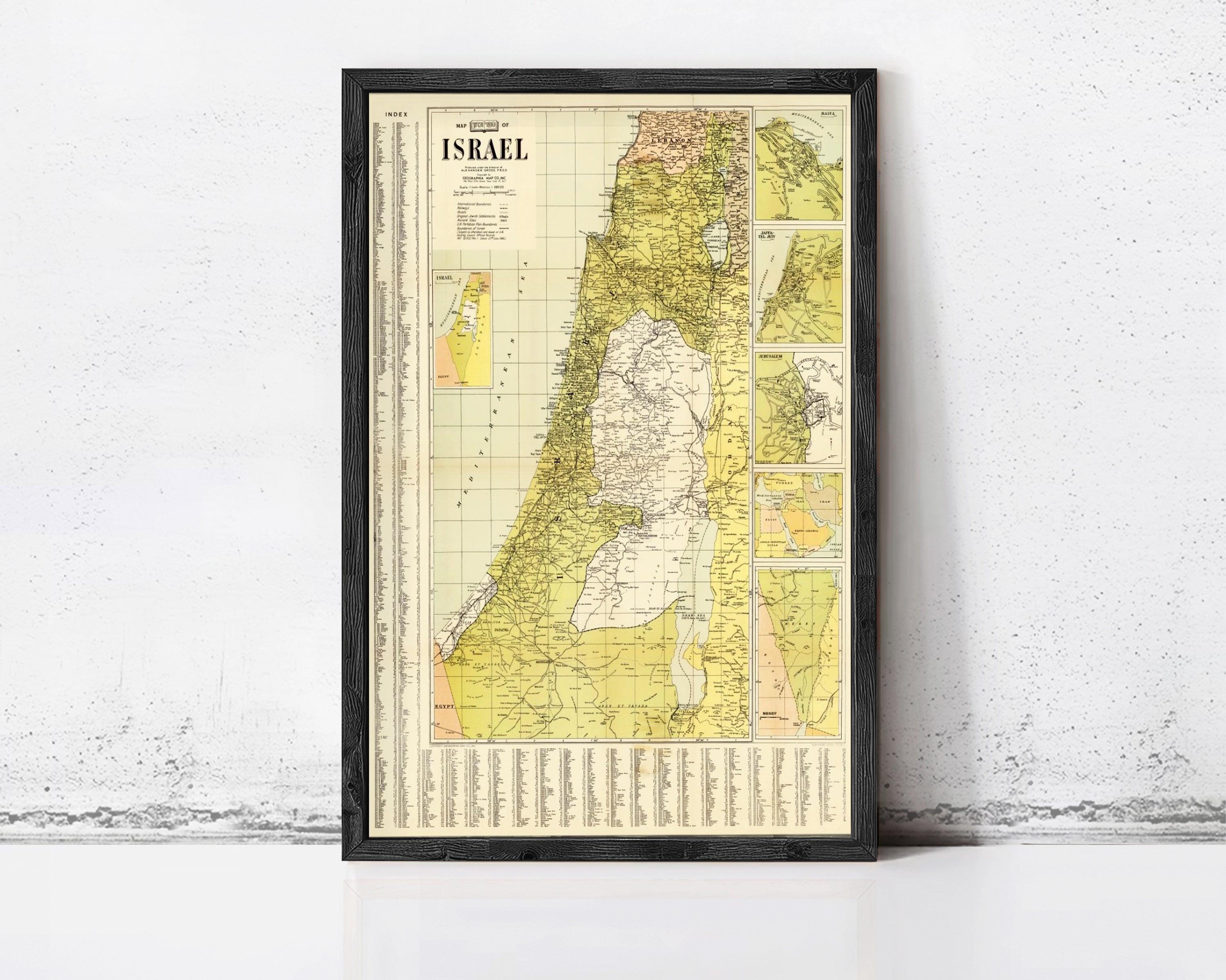 The image is a framed vintage map of Israel, depicting the country's geographical layout and boundaries.