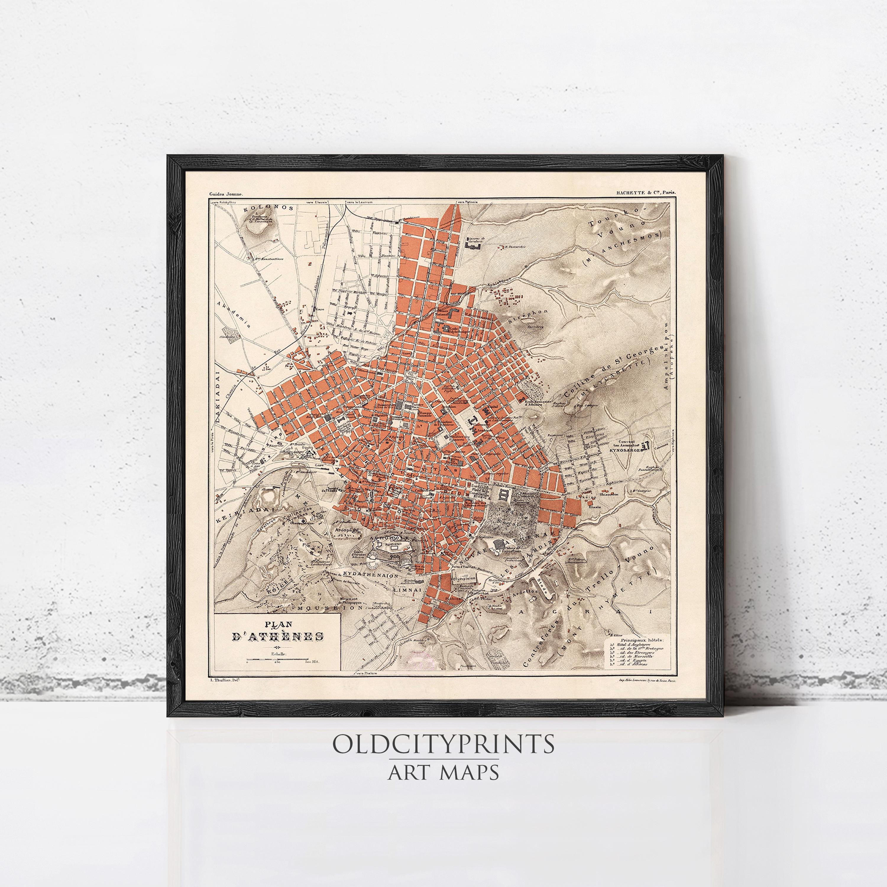 The image is a framed vintage map of a city, depicting the layout and streets of the area.