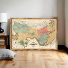 The image is a framed vintage map of Cambridge, Massachusetts, showing the city's streets and surrounding areas.