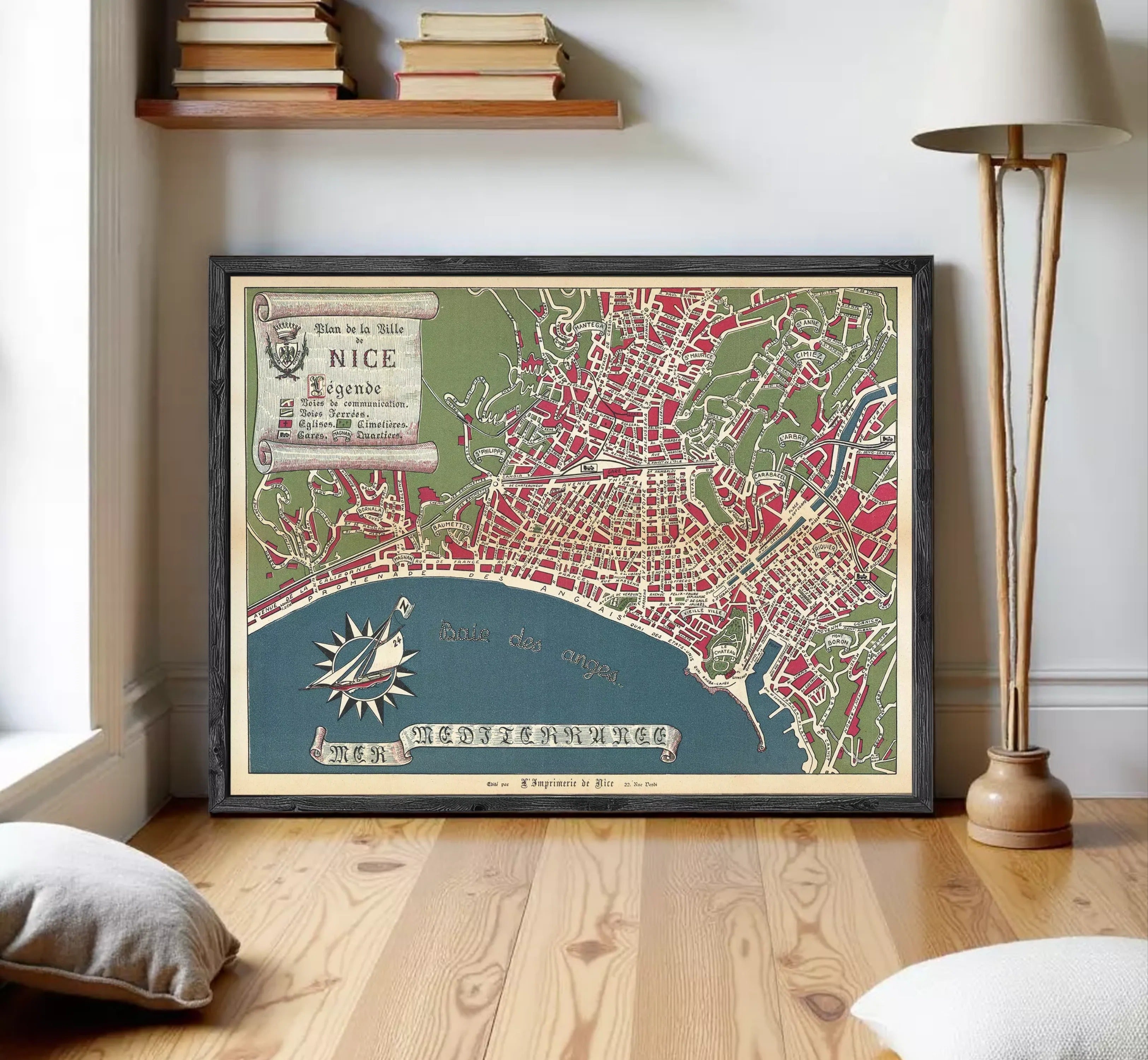 The image is a framed vintage map of Nice, France, depicting the city's layout and surrounding areas.