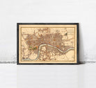 A framed map of London, England, dating back to the year 1753.
