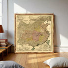 The image is a framed vintage map of China, featuring detailed cartography and geographical information.