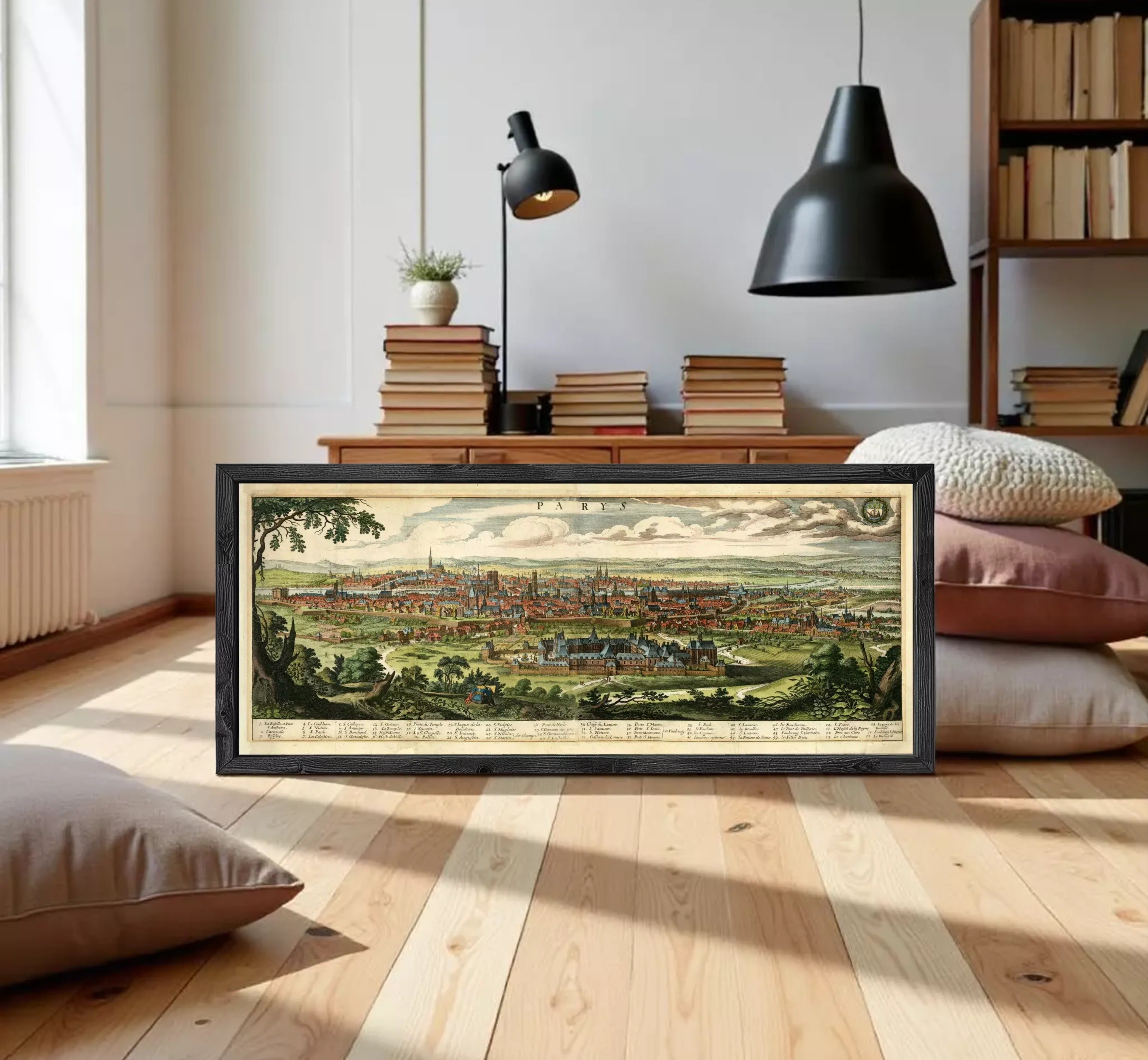 A framed illustration of a cityscape depicting a large, densely populated urban area with a mix of buildings, roads, and natural elements such as trees and grass.