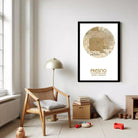 a cozy living room with a wooden chair, a lamp, and a framed map of Fresno, California.