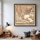 a large framed map of the United States hanging on a wall in a room.