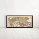 A framed historical map of London, featuring a detailed illustration of the city's streets, landmarks, and waterways.