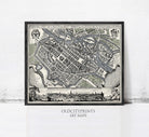 The image is a framed vintage map of a city, likely from the 16th century, with detailed illustrations and labels.