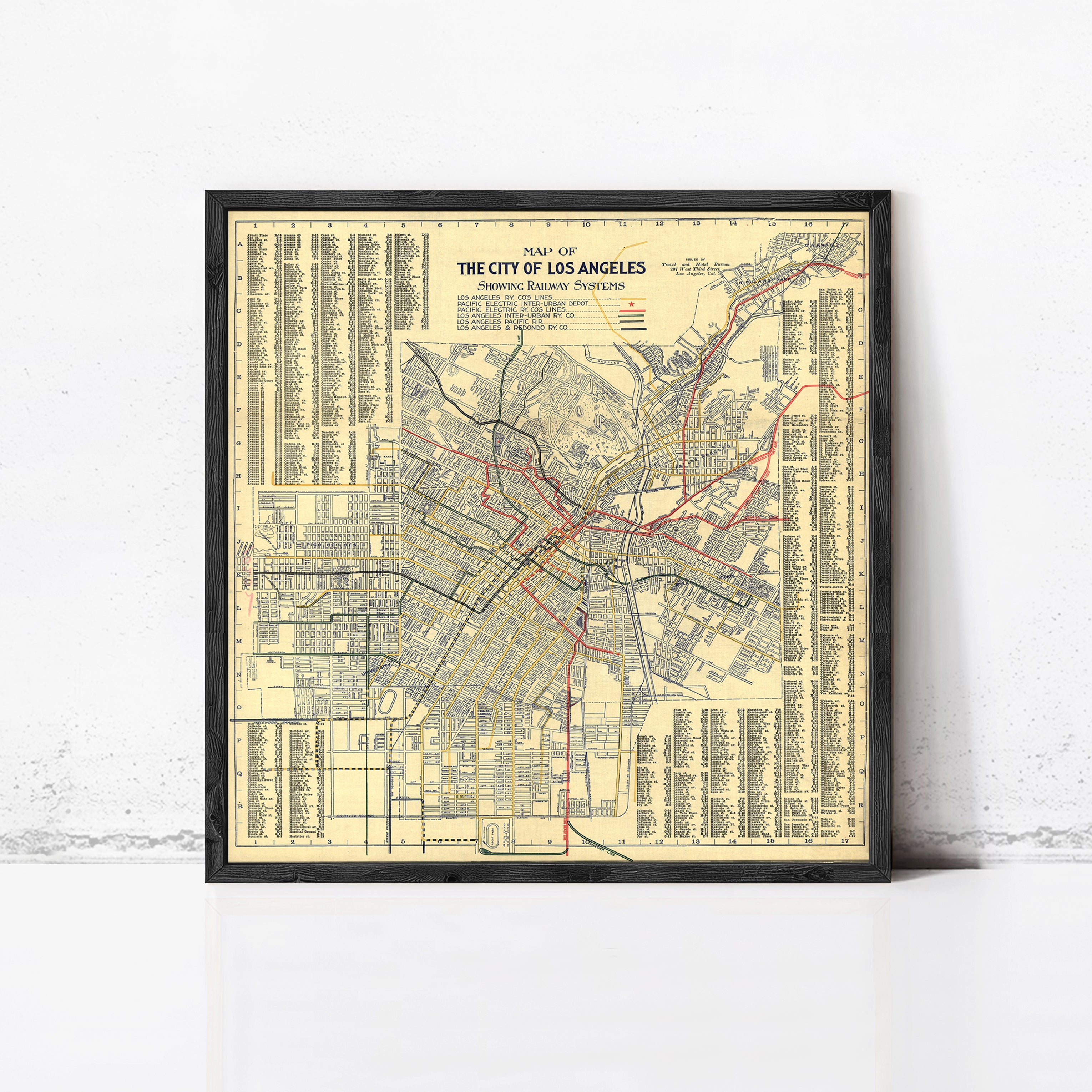 The image is a framed vintage map of Los Angeles, California, depicting the city's streets and transportation system.