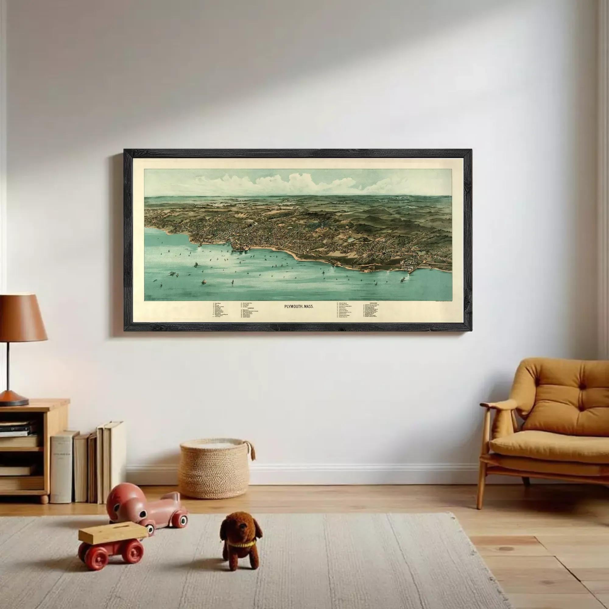 The image is a framed aerial map of a coastal city, depicting the city's layout, coastline, and surrounding areas.