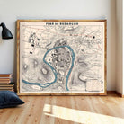 a large framed map of Besancón, a city in Spain, displayed on a wall.