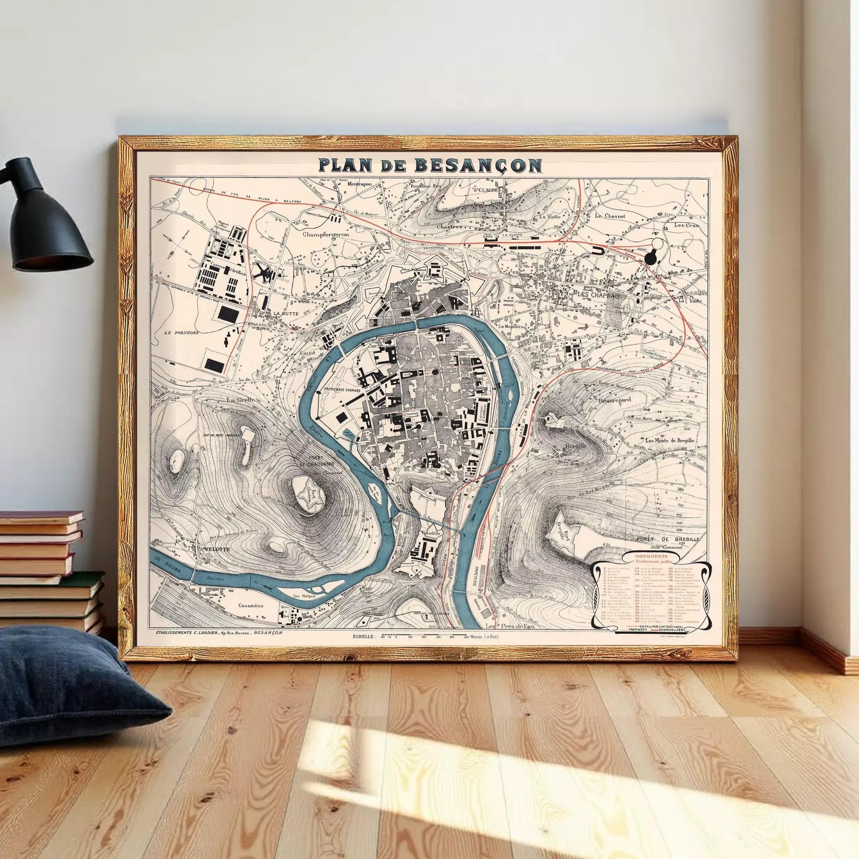 a large framed map of Besancón, a city in Spain, displayed on a wall.
