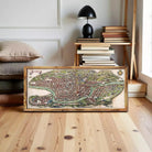 The image is a framed map of a city, depicting a detailed and intricate layout of the urban landscape.