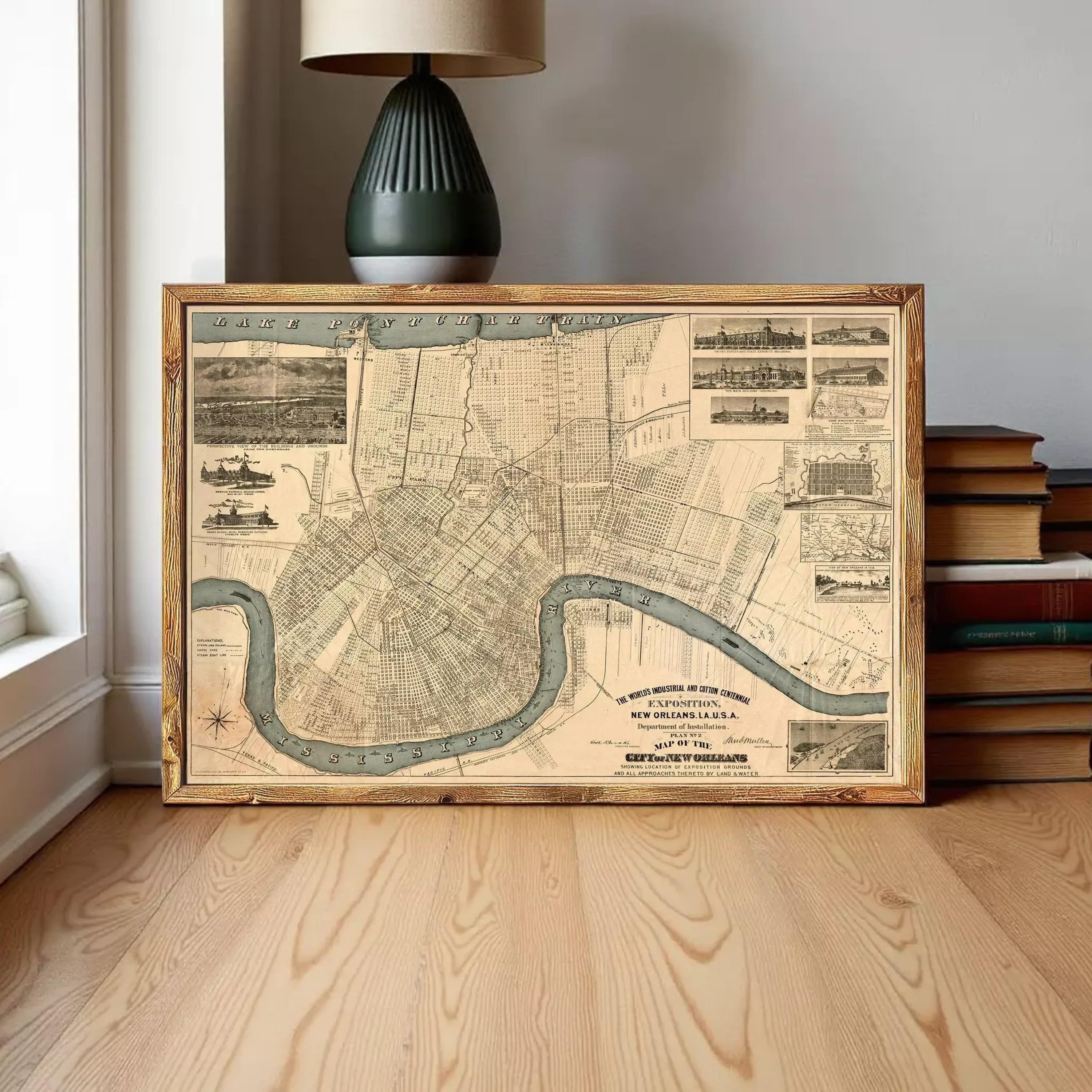 a framed map of New Orleans, Louisiana, with a lamp and books in the background.