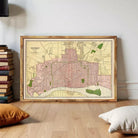 The image is a framed map of Detroit, Michigan, showing the city's streets, neighborhoods, and surrounding areas.