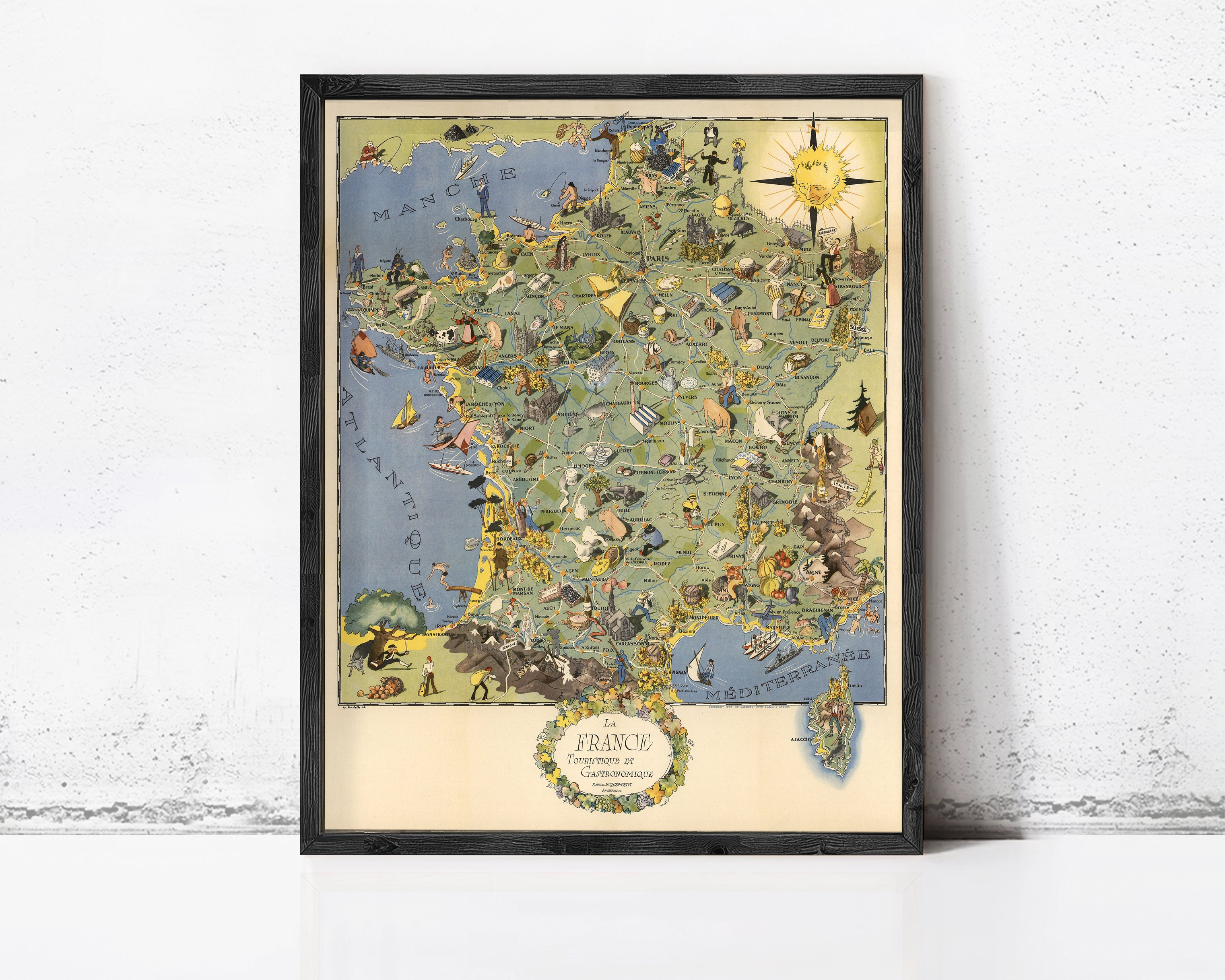 The image is a framed vintage map of France, featuring various landmarks, symbols, and illustrations that depict different aspects of the country.